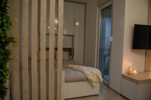 Ένα ή περισσότερα κρεβάτια σε δωμάτιο στο Apartman P Lux 2 Ćuprija