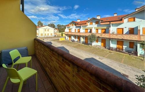 a balcony with two chairs and a view of a street at Solmare 5116 in Rosapineta