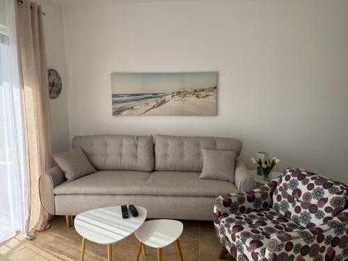 a living room with a couch and a coffee table at BlueCoast Apartment in Herceg-Novi