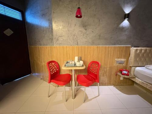 Giường trong phòng chung tại Eros Motel