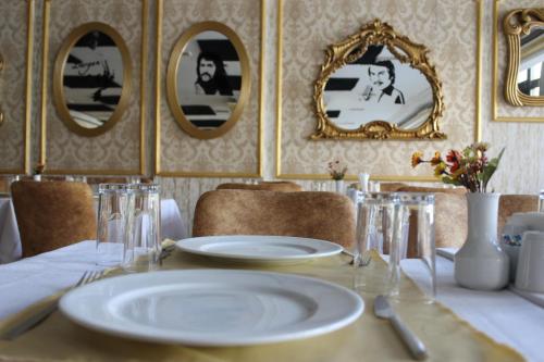a table with a white plate on top of it at ANGRAND HOTEL in Ankara