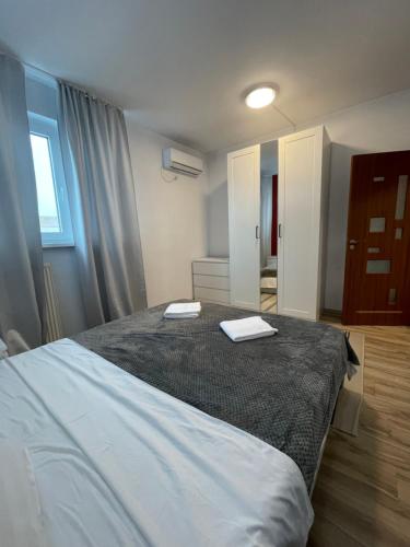 Postel nebo postele na pokoji v ubytování Marisah Rin Residence