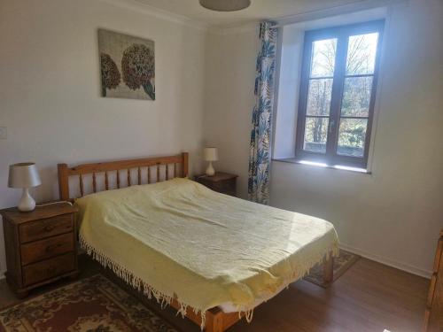 Ένα ή περισσότερα κρεβάτια σε δωμάτιο στο le petit chez soi du lac