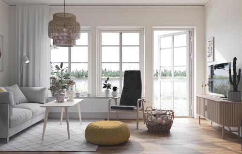 a living room with a couch and a chair at 2 Bedroom Amazing Home In Färjestaden in Algutsrum