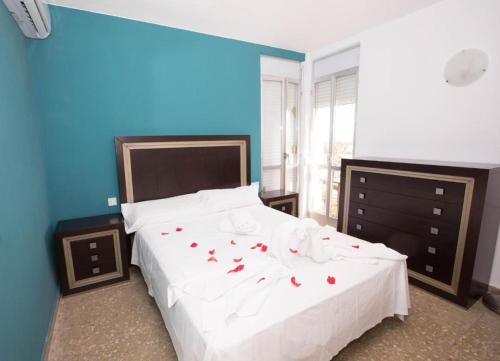 Ένα ή περισσότερα κρεβάτια σε δωμάτιο στο Apartalux Almerimar Beach