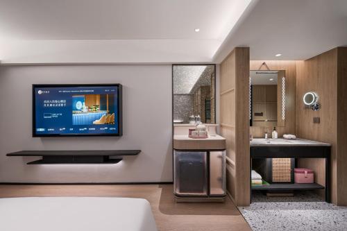 Μια τηλεόραση ή/και κέντρο ψυχαγωγίας στο Beijing Guomao Jianguomen Manxin Hotel