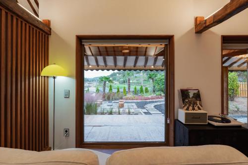 a bedroom with a sliding glass door to a patio at 고요별서 goyobyeolseo 