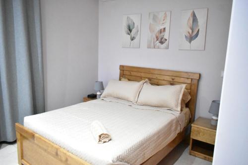 Llit o llits en una habitació de Cozy Palm