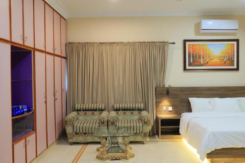 Postel nebo postele na pokoji v ubytování Majestic BnB