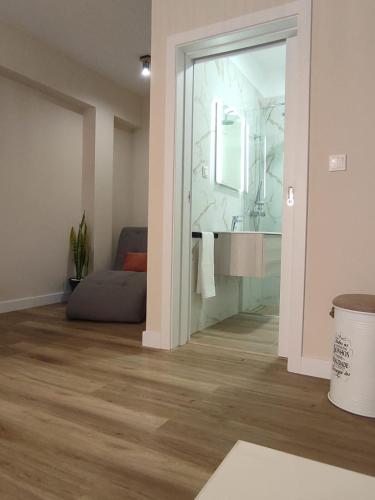 a bathroom with a sink and a mirror at Vitoria's Vale in Funchal