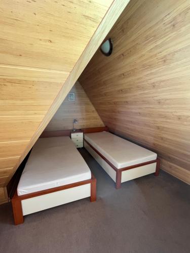 Ένα ή περισσότερα κρεβάτια σε δωμάτιο στο Wilinianka