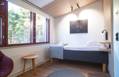 Ένα ή περισσότερα κρεβάτια σε δωμάτιο στο Hotel Linnasmäki