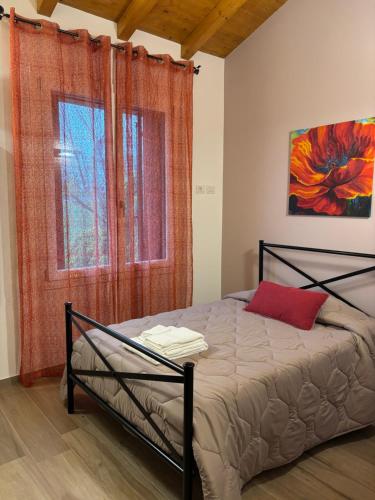 Ένα ή περισσότερα κρεβάτια σε δωμάτιο στο Pitaciò Affittacamere