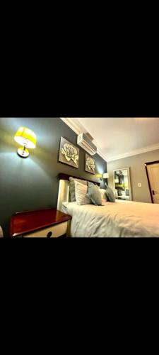 Кровать или кровати в номере Sifumasa Guesthouse