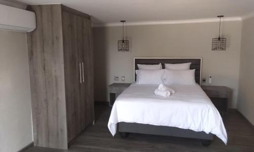 Кровать или кровати в номере Sifumasa Guesthouse