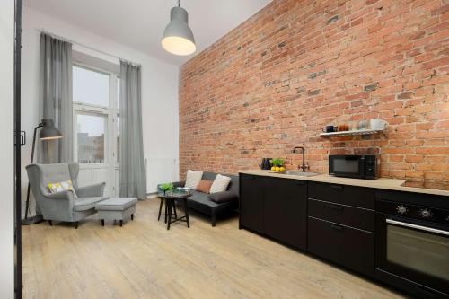 Stylish Apartment with Mezzanine, next to Metro Station by Noclegi Renters