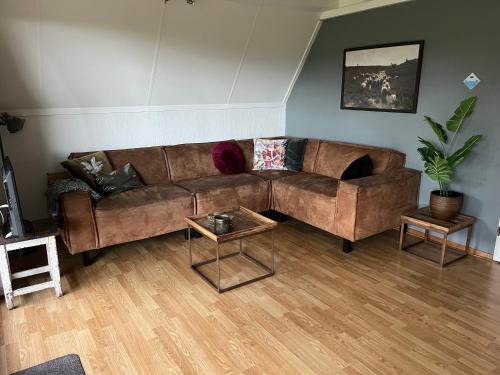 Posezení v ubytování Heggenmus I Huisje met Haard in de Tuin