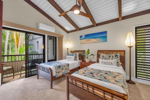 a bedroom with two beds and a balcony at Wailea Ekolu 1604 · WE 1604 Wailea 2BD Condo w AC Pool Near Beac in Kihei