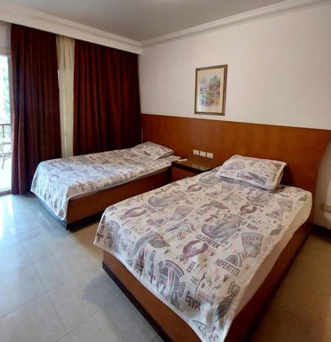 Una cama o camas en una habitación de Delta Sharm Resort