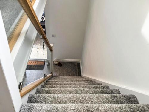 a staircase leading up to the top of a house at Tilia Loft in Scotter