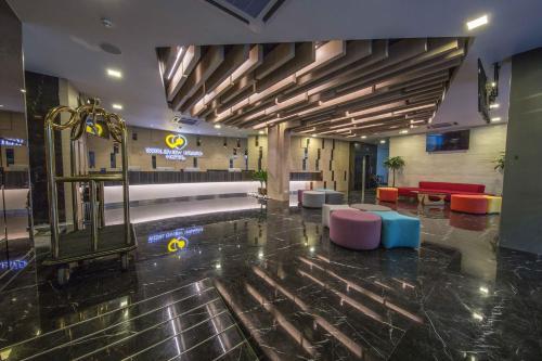 a lobby with a pool in the middle of a building at Worldview Grand Hotel in Kuala Lumpur