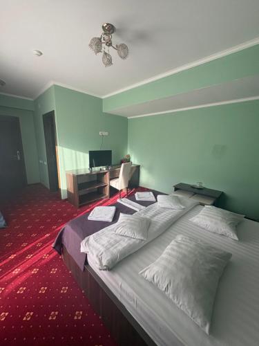 Ένα ή περισσότερα κρεβάτια σε δωμάτιο στο Hotel Abi