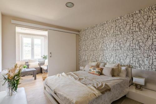 a bedroom with a large bed and a large wall mural at El mirador de Teresa in Arróniz