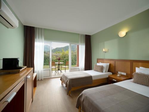 Ένα ή περισσότερα κρεβάτια σε δωμάτιο στο Odile Hotel Çıralı