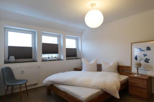 En eller flere senge i et værelse på Wunderschöne große Ferienwohnung in Aue