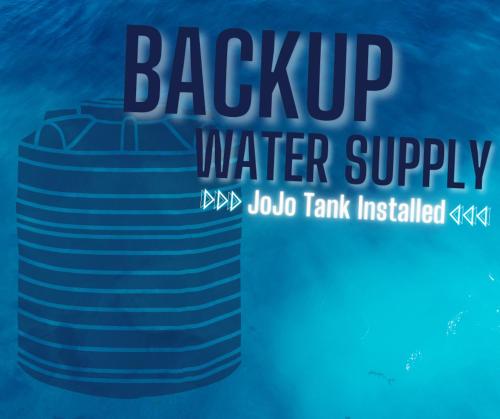 a sign that reads back up water supply at Guernsey Home in Port Shepstone