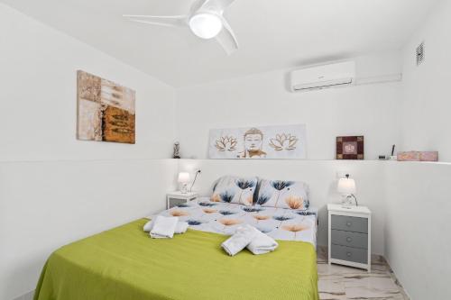 Una cama o camas en una habitación de La Casa de La Felicidad