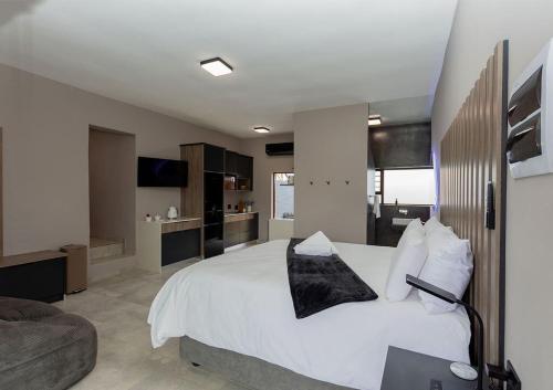 En eller flere senge i et værelse på Modern 4 sleeper, hot tub, BBQ