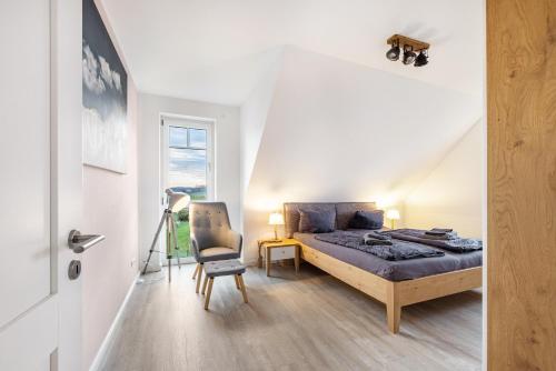 Ένα ή περισσότερα κρεβάτια σε δωμάτιο στο Ferienhaus Treibholz