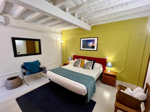 a bedroom with a bed and a blue chair at Charming Navona in Rome