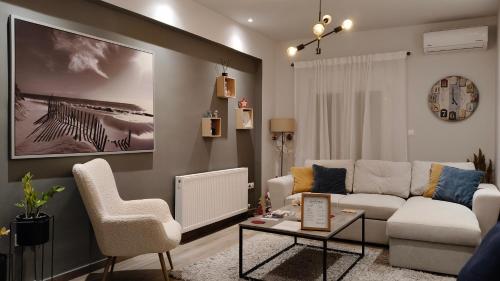 a living room with a couch and two chairs at Your Pin -non- the rest in Tríkala