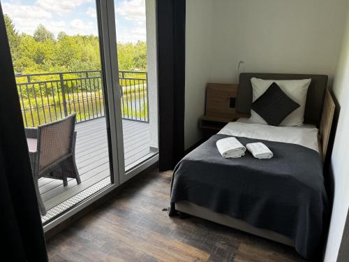 Postel nebo postele na pokoji v ubytování East-Riverside Boardinghouse