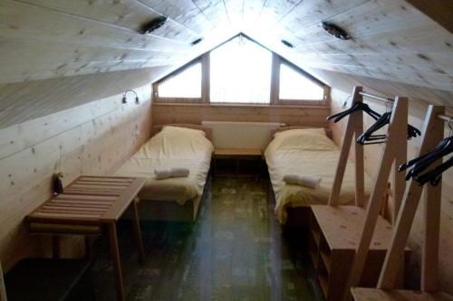 a room with two beds and a window in it at Chalet Auhof in Flachau