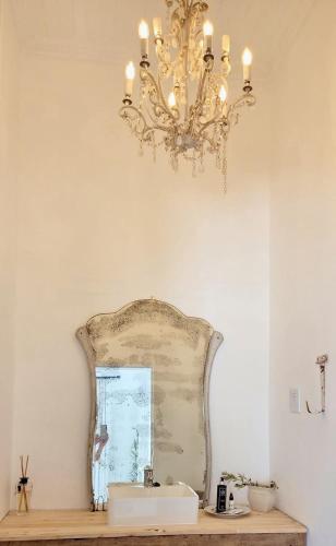 a bathroom with a sink and a chandelier at Stay at Richmond in Richmond