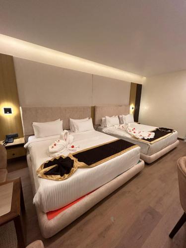 Postel nebo postele na pokoji v ubytování Hotel Oxina Cizel