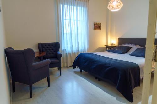 Ένα ή περισσότερα κρεβάτια σε δωμάτιο στο Engels herenhuis