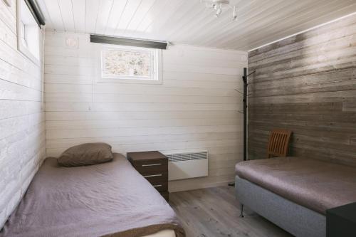 Postel nebo postele na pokoji v ubytování Stuga på ö / närhet till vatten
