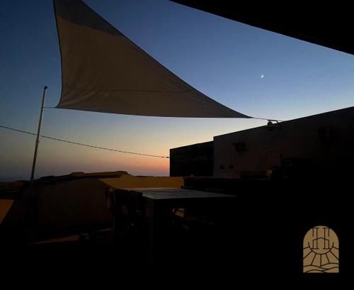a view from the inside of a building with a table at Cap Helios l ecrin corse a couper le souffle in Morsiglia