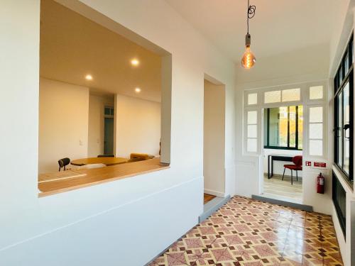 a room with a mirror and a table at Sunny Escape - Ponta do Sol -- Vila Silva Upstairs in Ponta do Sol