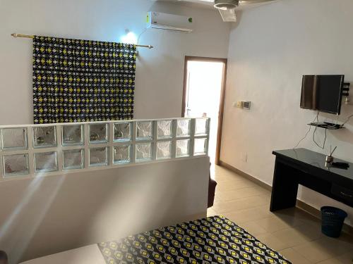 TV a/nebo společenská místnost v ubytování Résidence Agbevivi