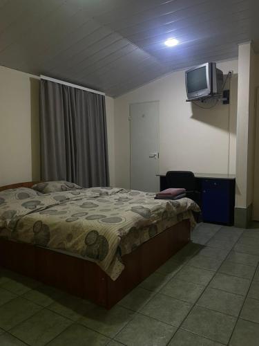 Llit o llits en una habitació de Tima Hotel Chisinau