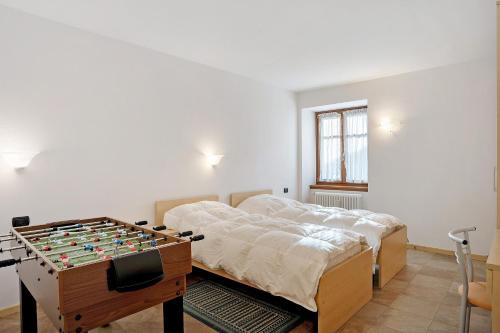 Ένα ή περισσότερα κρεβάτια σε δωμάτιο στο Casa Brenta - Alpine Charm