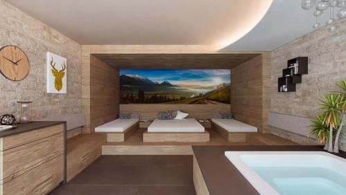 a bathroom with a tub and a painting on the wall at Hotel Rosner in Altenmarkt im Pongau