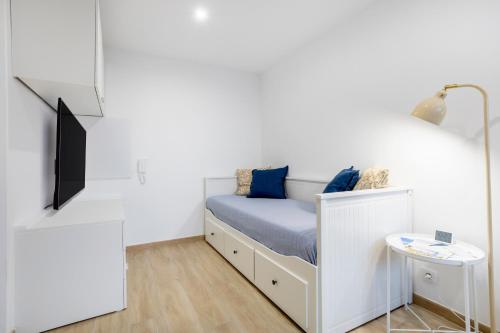 Ένα ή περισσότερα κρεβάτια σε δωμάτιο στο Les studios Bigoudens