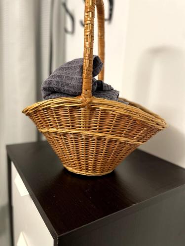 a basket sitting on top of a black table at Charming apartment with industrial design close to city center in Växjö