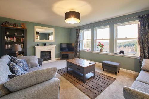 a living room with a couch and a table at Host & Stay - Carterhouse in Jedburgh